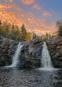 Two waterfalls falling into a river to represent successful M&A after Houston mergers and acquisition advisory