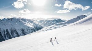 one man leading another while hiking to illustrate how interim CFO leads financial team 