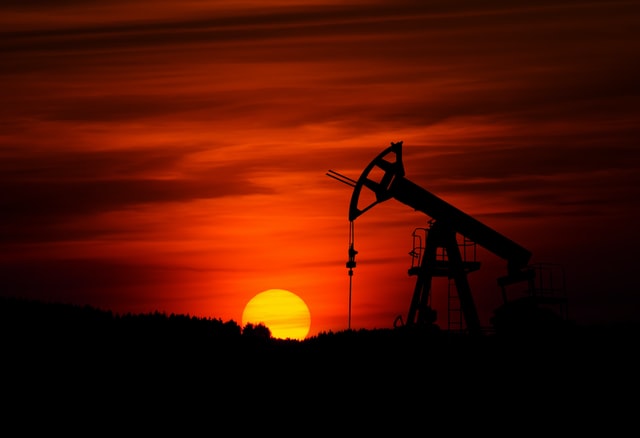 oil well against beautiful sunset after the producer pursued business financing solutions for their operations